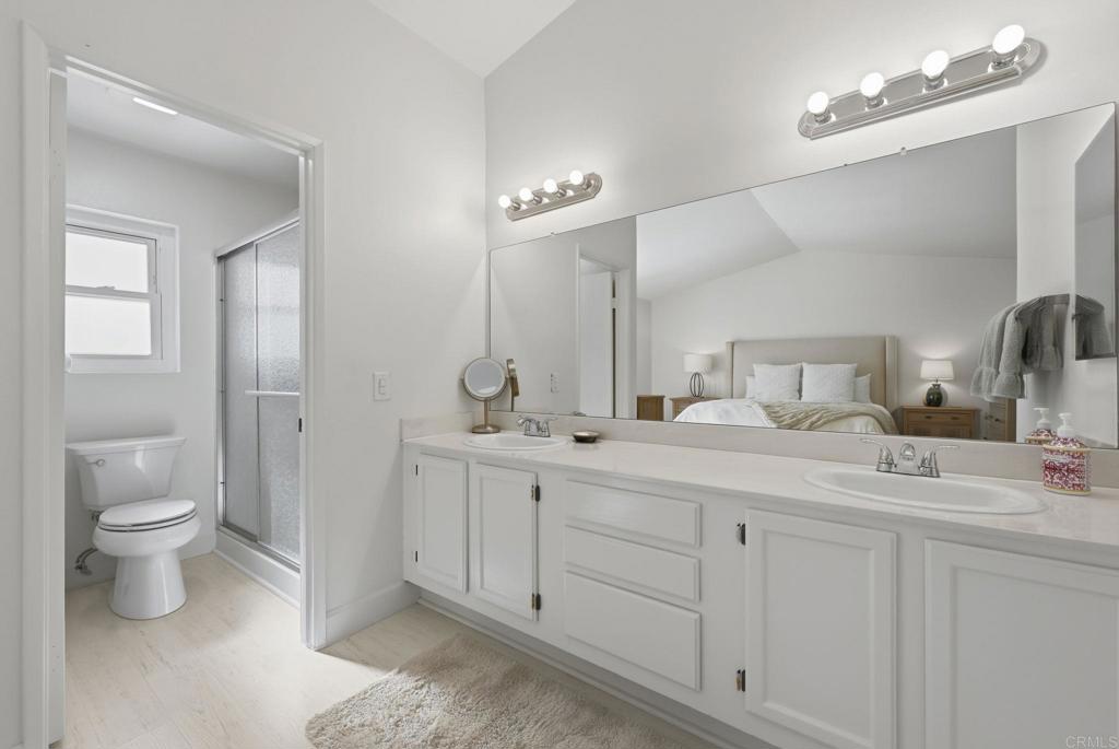 2972 Lancaster Road Carlsbad, CA 92010 - Photo 27 of 36 a bathroom with a double vanity sink and a toilet