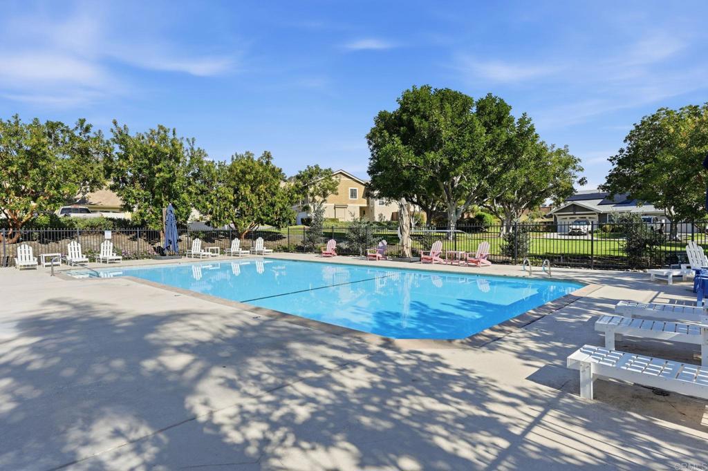 2972 Lancaster Road Carlsbad, CA 92010 - Photo 35 of 36 a view of a swimming pool with an outdoor seating and a garden