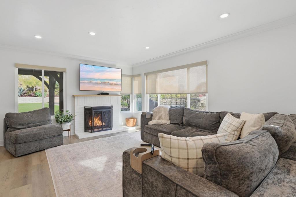2972 Lancaster Road Carlsbad, CA 92010 - Photo 4 of 36 a living room with furniture and a fireplace