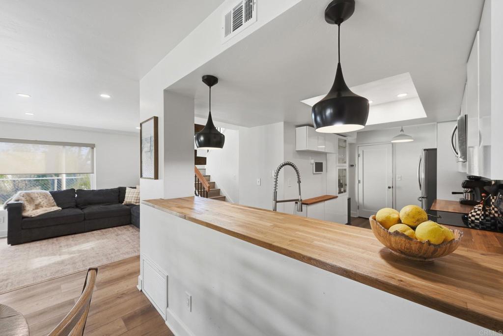 2972 Lancaster Road Carlsbad, CA 92010 - Photo 9 of 36 a living room with furniture and kitchen view