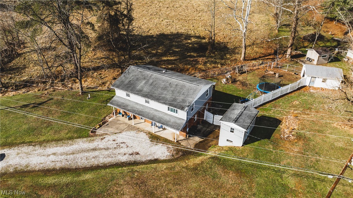 111 River Hill Road Washington, WV 26181 - Photo 27 of 29 Looking at the property from the front aerial view. Notice side building and another garage storage building in the back yard for all your outside storage needs.
