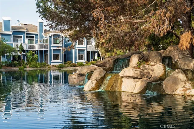 an aerial view of a house with outdoor space and street view