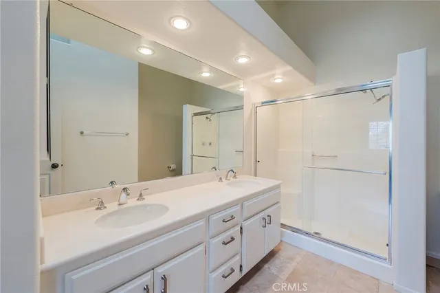a bathroom with a shower and a sink