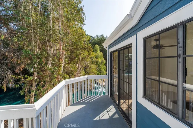 a view of a brick house with a large window