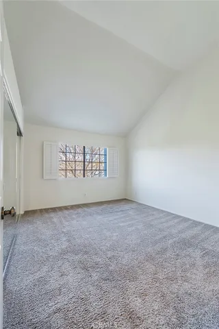 a backyard of a house with a garden and lake view