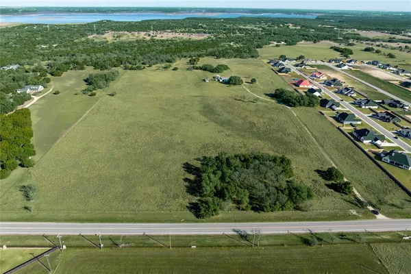 an aerial view of a residential houses with outdoor space