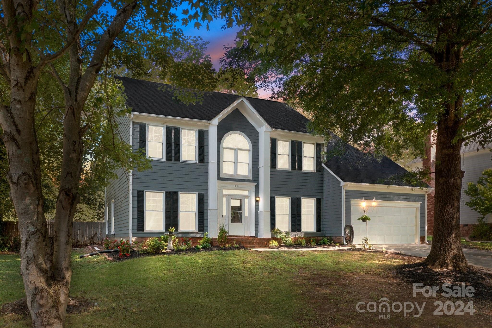 1041 Fairway Ridge Drive Northwest Concord, NC 28027 - Photo 1 of 44 front view of a house with a yard