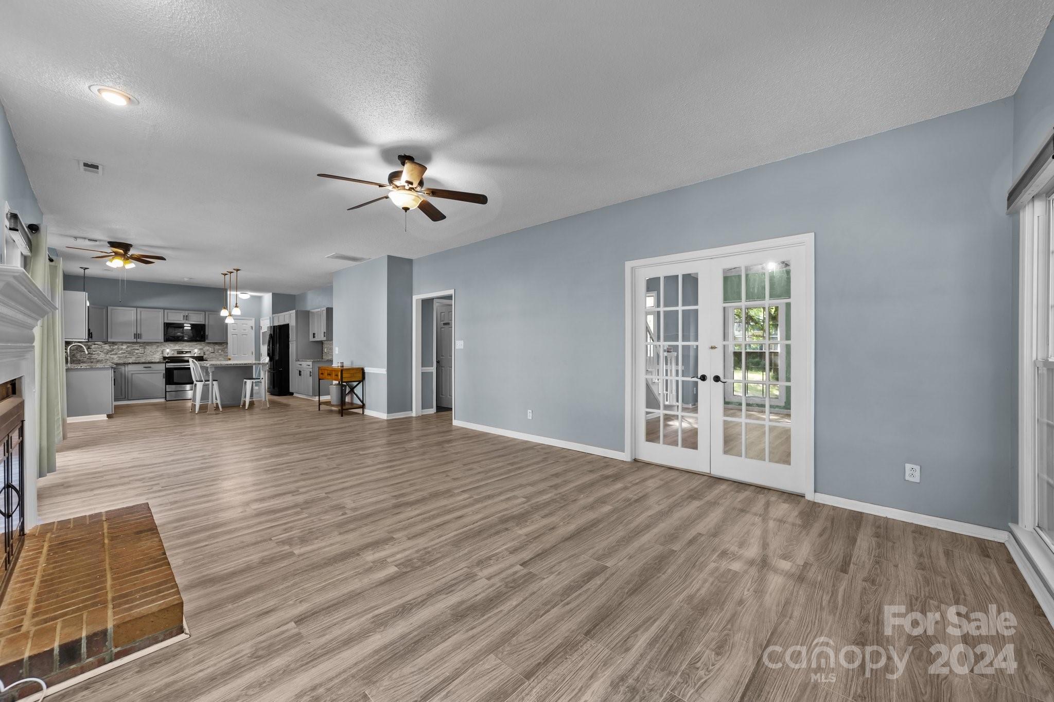 1041 Fairway Ridge Drive Northwest Concord, NC 28027 - Photo 12 of 44 a view of a livingroom with furniture and a ceiling fan