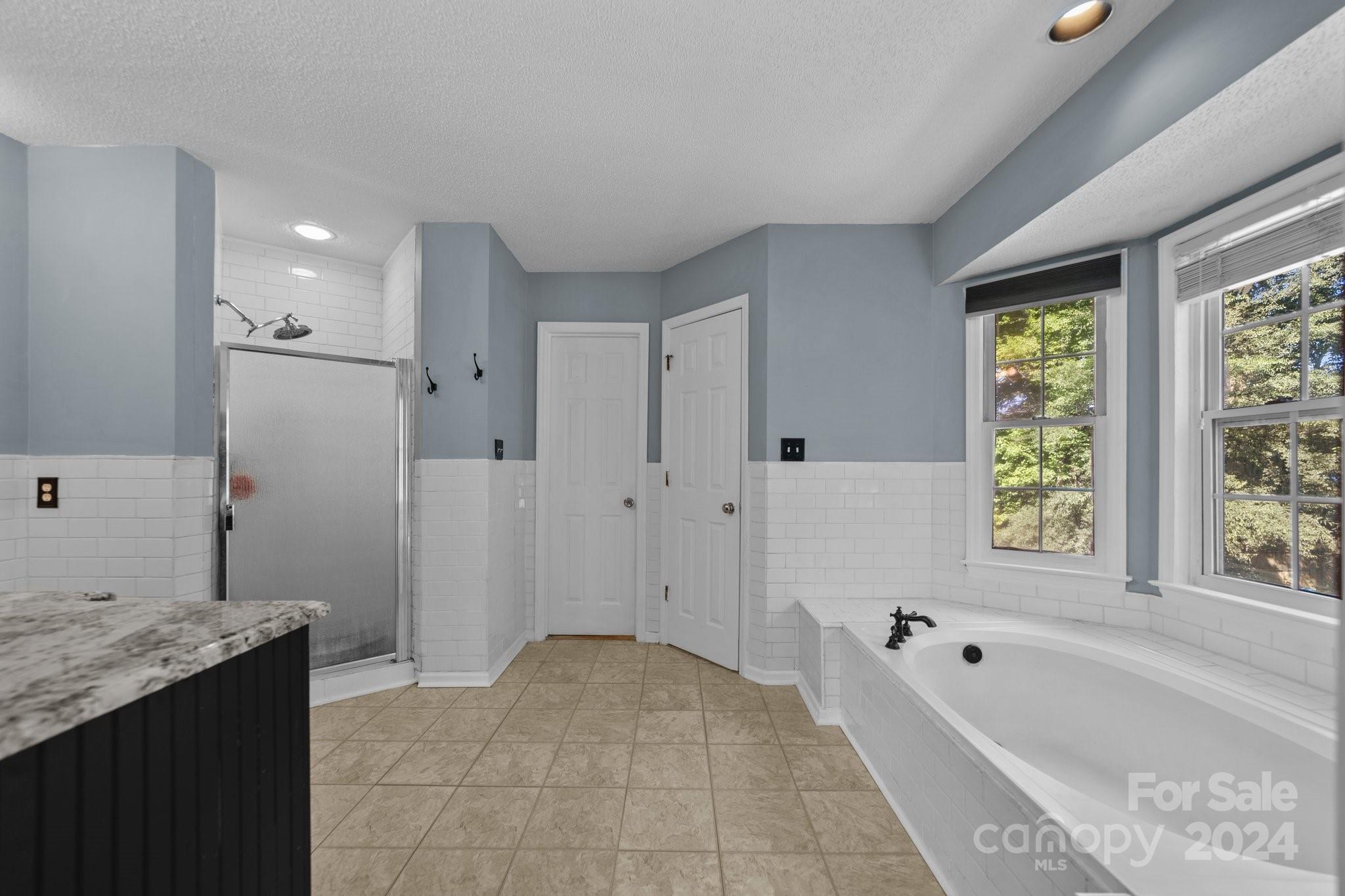 1041 Fairway Ridge Drive Northwest Concord, NC 28027 - Photo 25 of 44 a bathroom with a bathtub and a sink