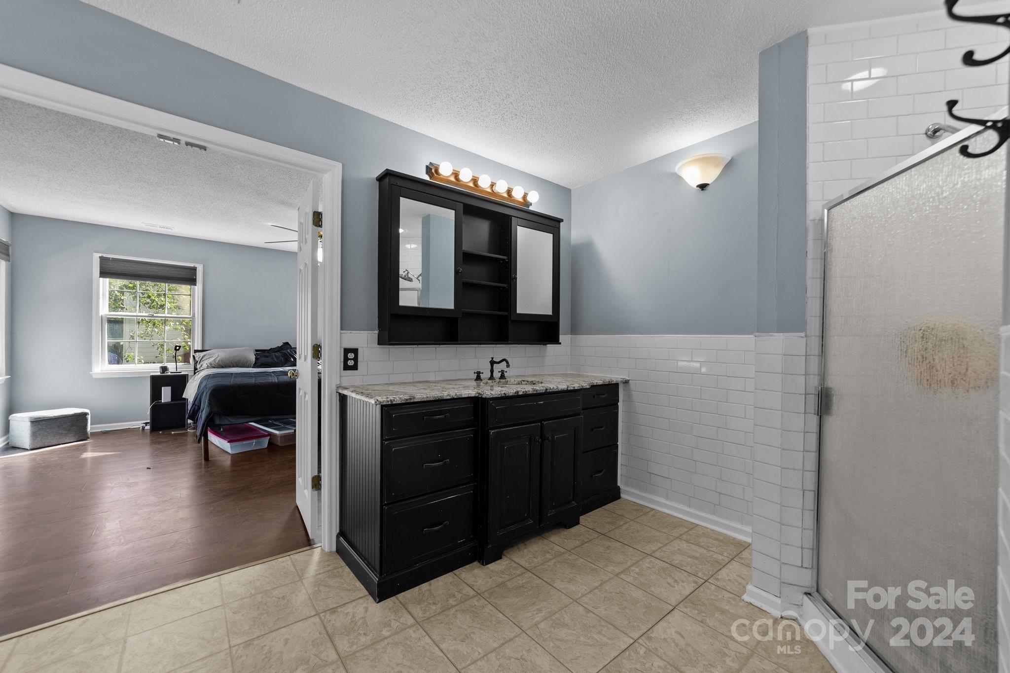 1041 Fairway Ridge Drive Northwest Concord, NC 28027 - Photo 27 of 44 a spacious bathroom with a tub sink and mirror