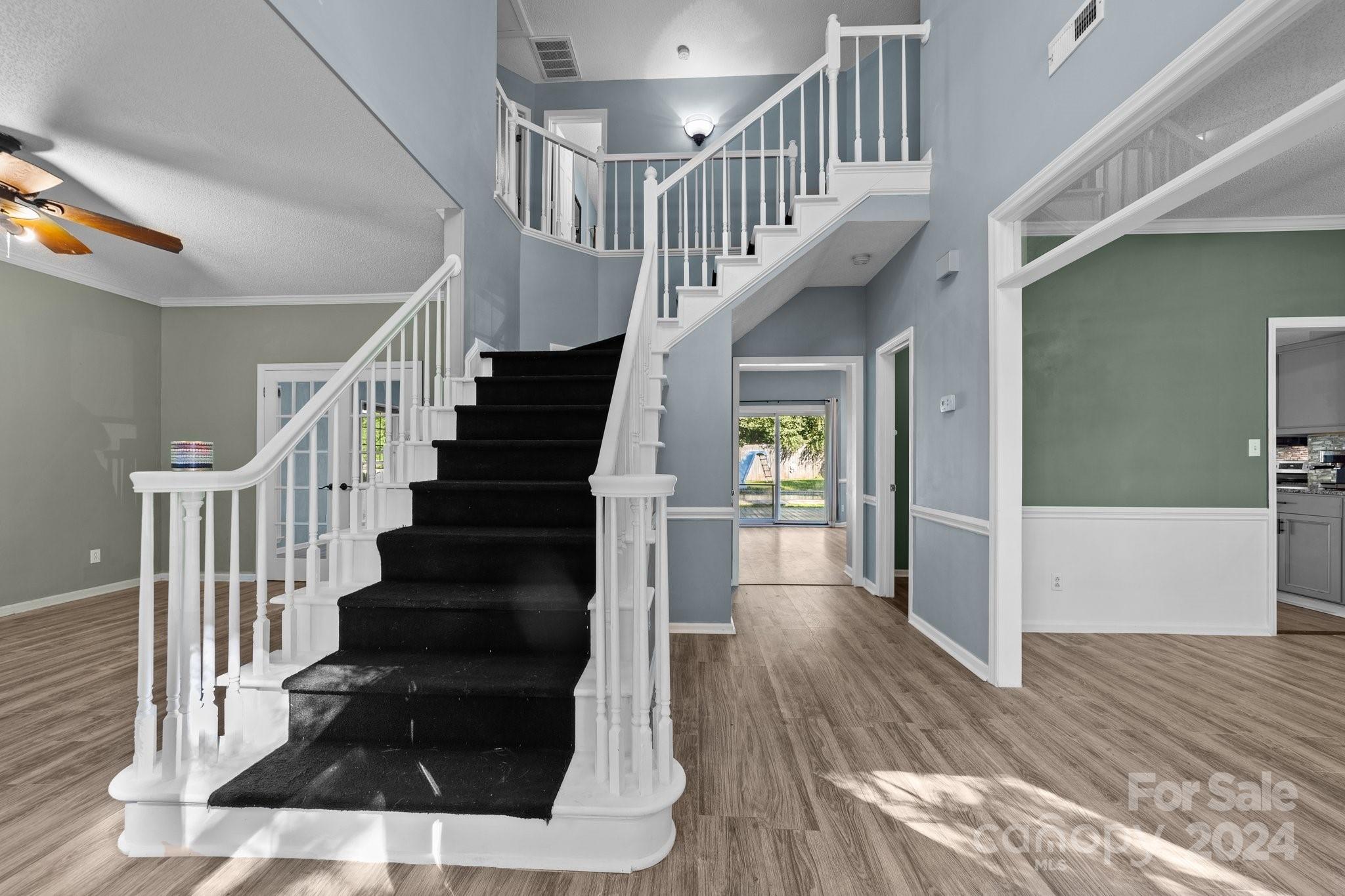 1041 Fairway Ridge Drive Northwest Concord, NC 28027 - Photo 3 of 44 a view of entryway and hall with wooden floor