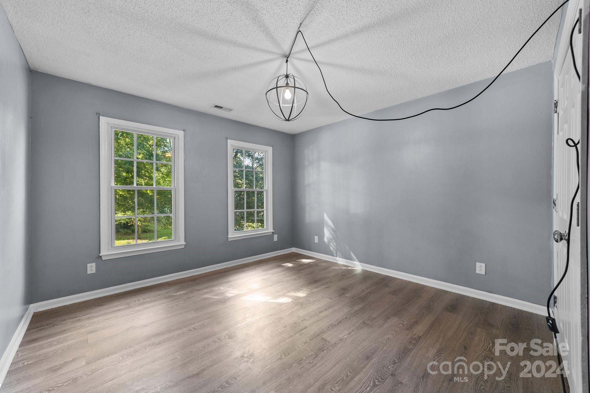 1041 Fairway Ridge Drive Northwest Concord, NC 28027 - Photo 33 of 44 a view of big room with wooden floor fan and windows