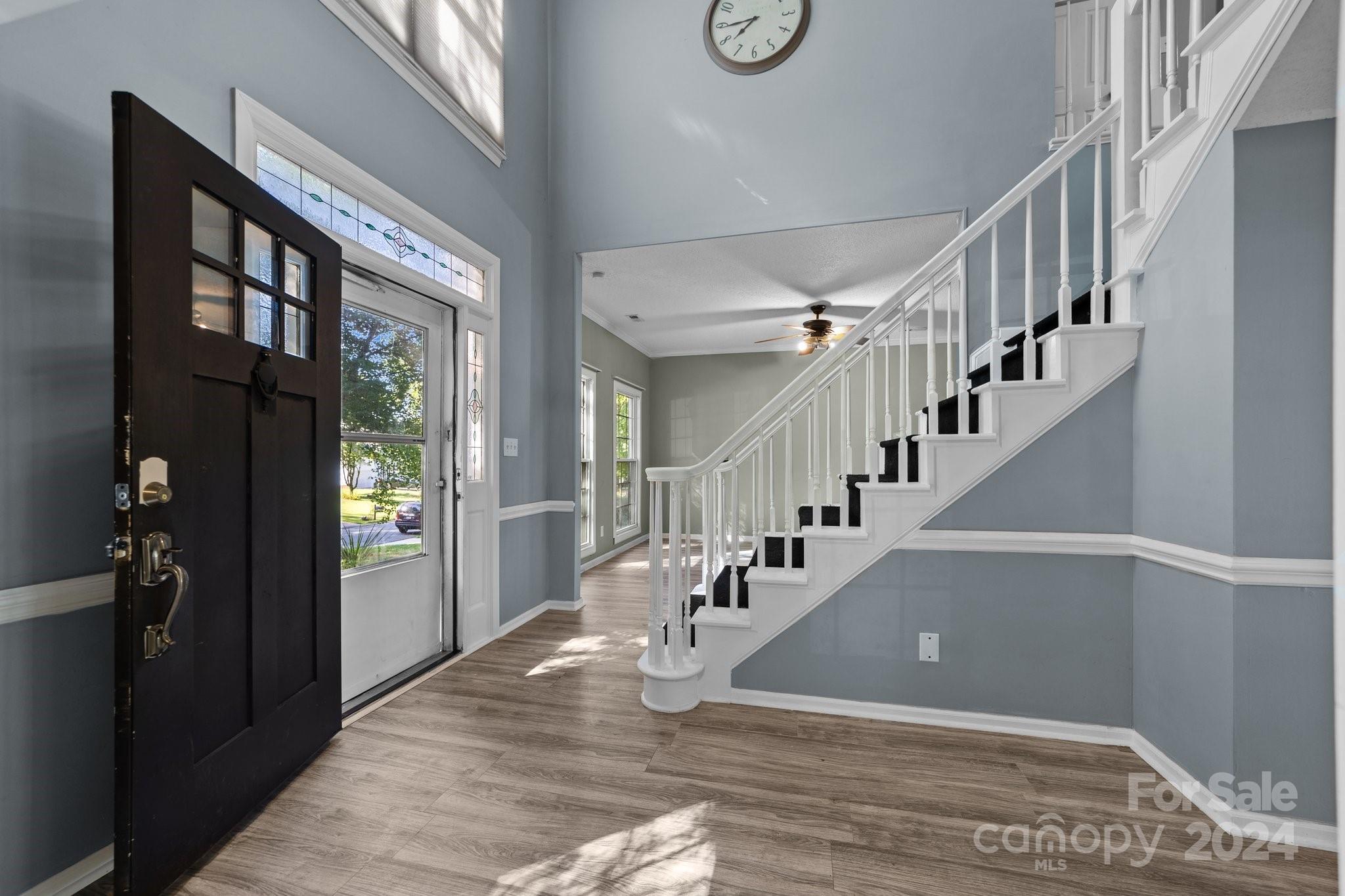 1041 Fairway Ridge Drive Northwest Concord, NC 28027 - Photo 4 of 44 a view of entryway and hall with wooden floor