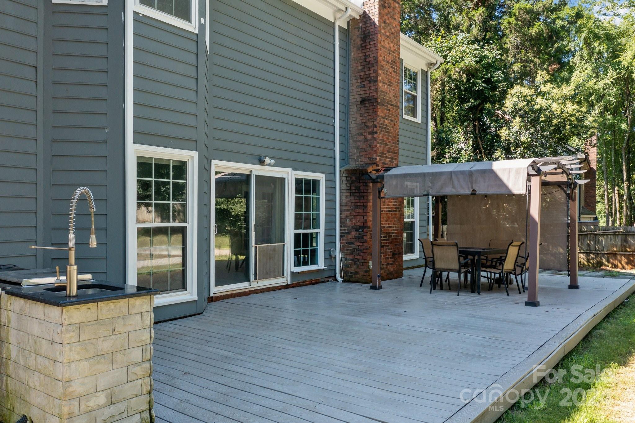1041 Fairway Ridge Drive Northwest Concord, NC 28027 - Photo 41 of 44 a view of a patio with table and chairs
