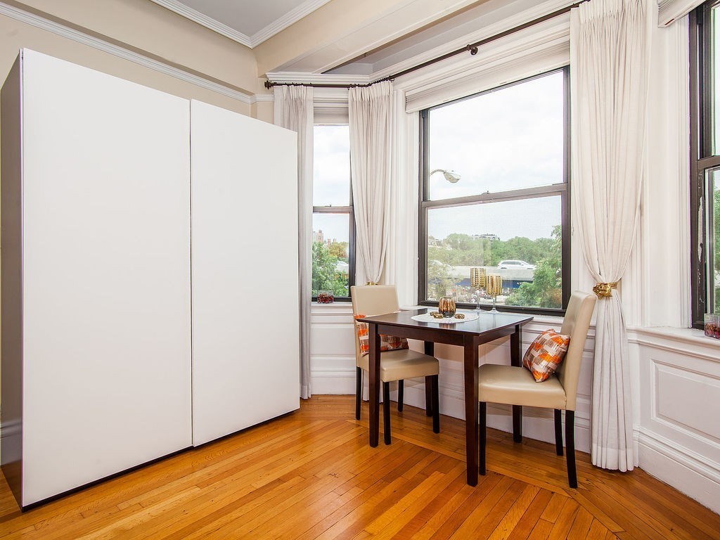 464 Commonwealth Avenue, Unit 36 Boston, MA 02215 - Photo 1 of 18 a dining room with furniture and wooden floor