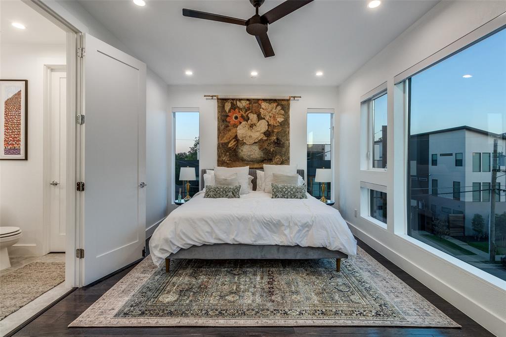 4805 Manett Street, Unit 101 Dallas, TX 75204 - Photo 11 of 18 a spacious bedroom with a large bed and a rug