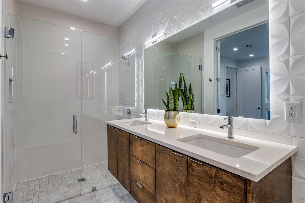 4805 Manett Street, Unit 101 Dallas, TX 75204 - Photo 14 of 18 a bathroom with double sink and a mirror