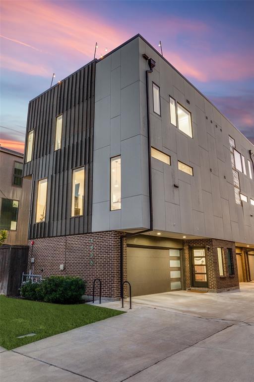 4805 Manett Street, Unit 101 Dallas, TX 75204 - Photo 2 of 18 a front view of a building with a yard