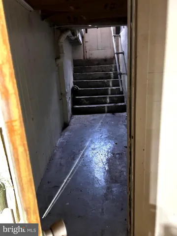 a view of a house with a wooden deck