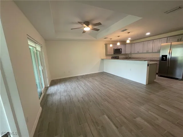 a view of kitchen with wooden floor