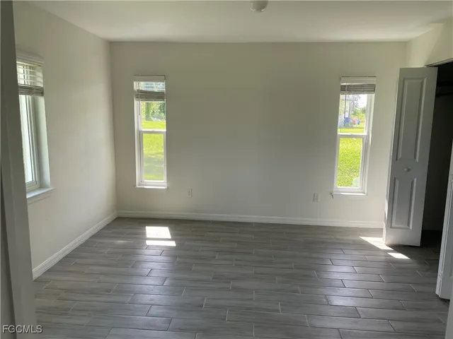 a bathroom with a toilet sink and shower