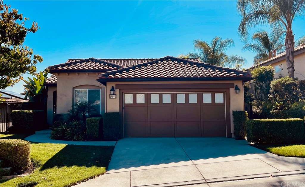 24042 Boulder Oaks Drive Corona, CA 92883 - Photo 1 of 8 a front view of a house with garden