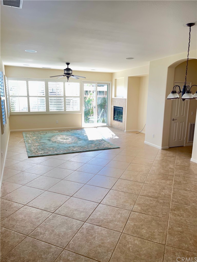 24042 Boulder Oaks Drive Corona, CA 92883 - Photo 3 of 8 a view of living room with granite countertop furniture and fireplace