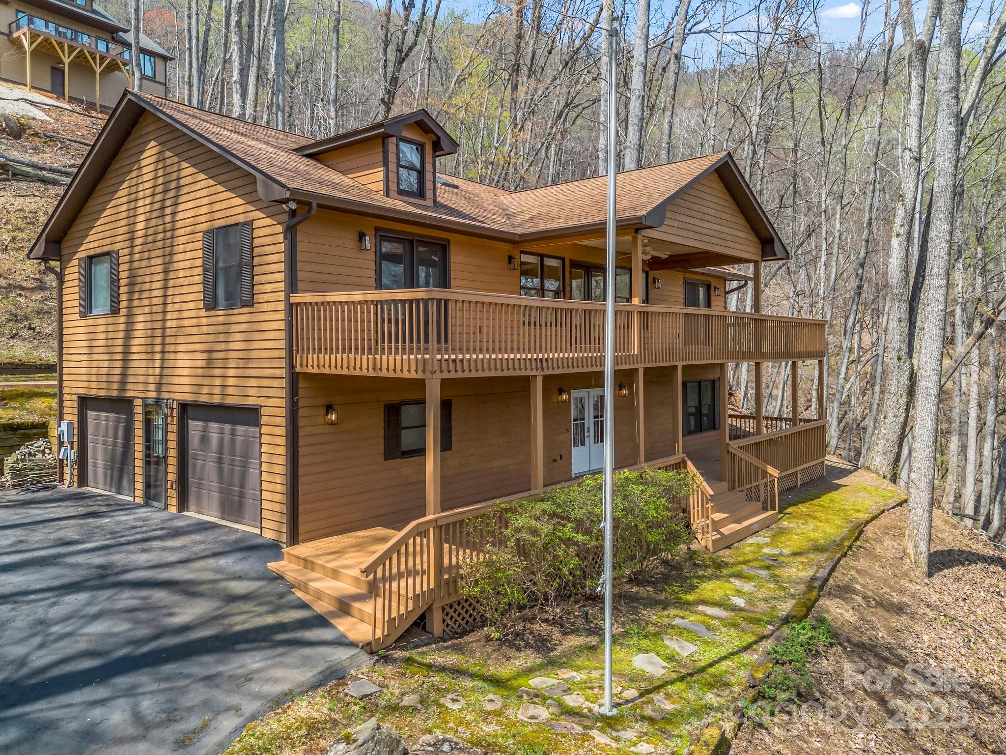 1116 High Vista Drive Mills River, NC 28759 - Photo 1 of 40 a view of a house with a small yard and wooden fence