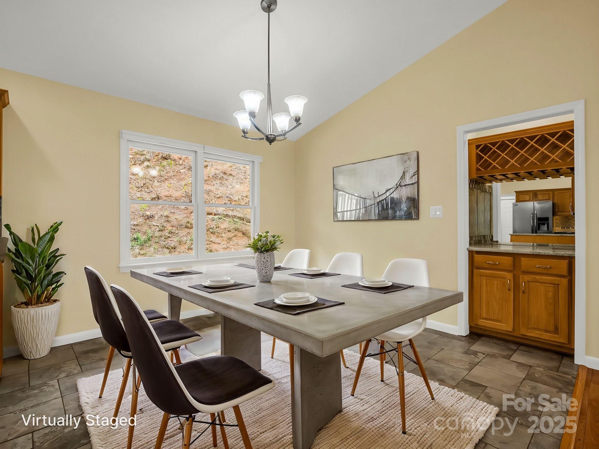 1116 High Vista Drive Mills River, NC 28759 - Photo 12 of 40 a view of a dining room with furniture window and wooden floor