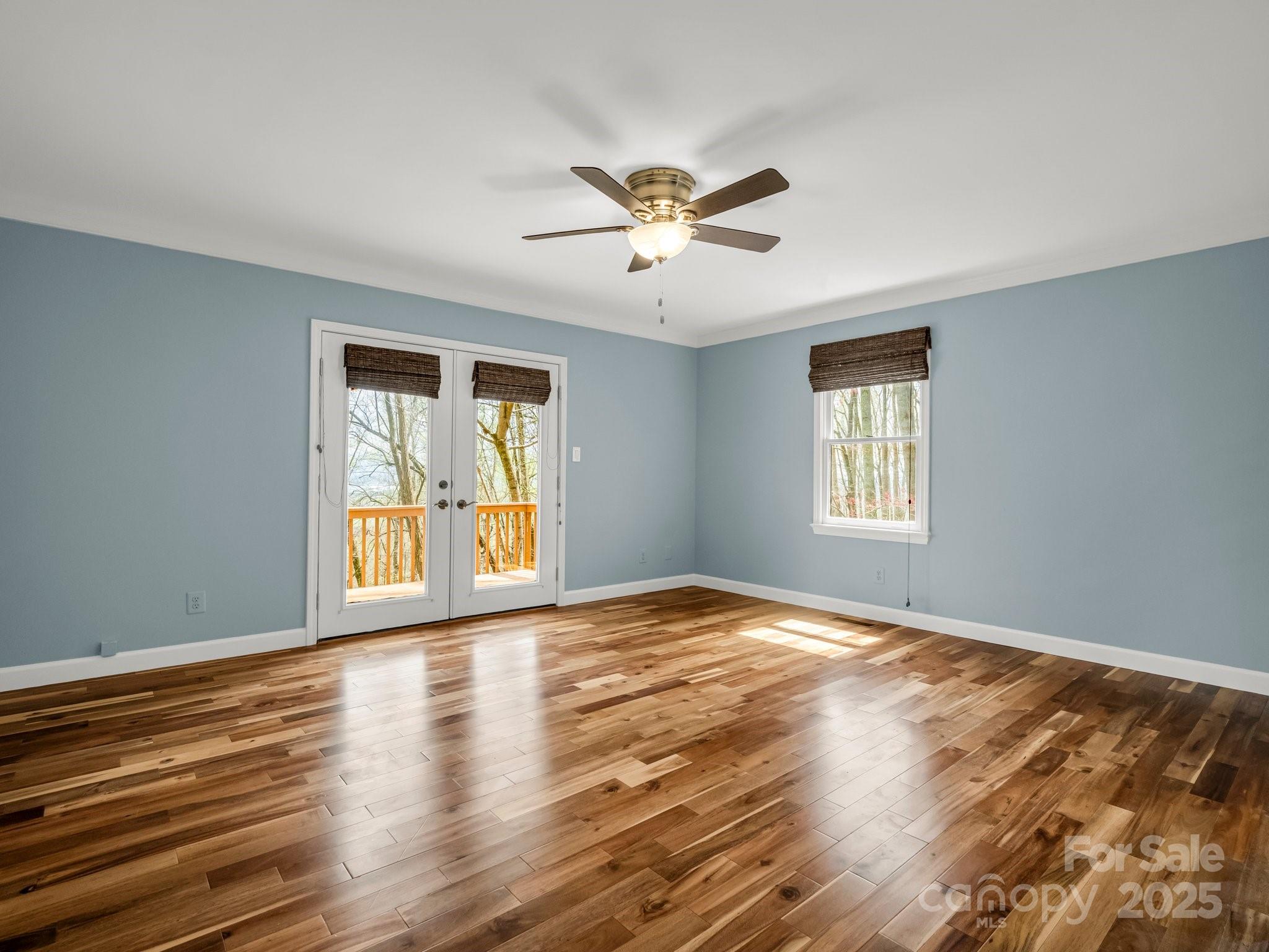 1116 High Vista Drive Mills River, NC 28759 - Photo 19 of 40 a view of an empty room with a window and wooden floor