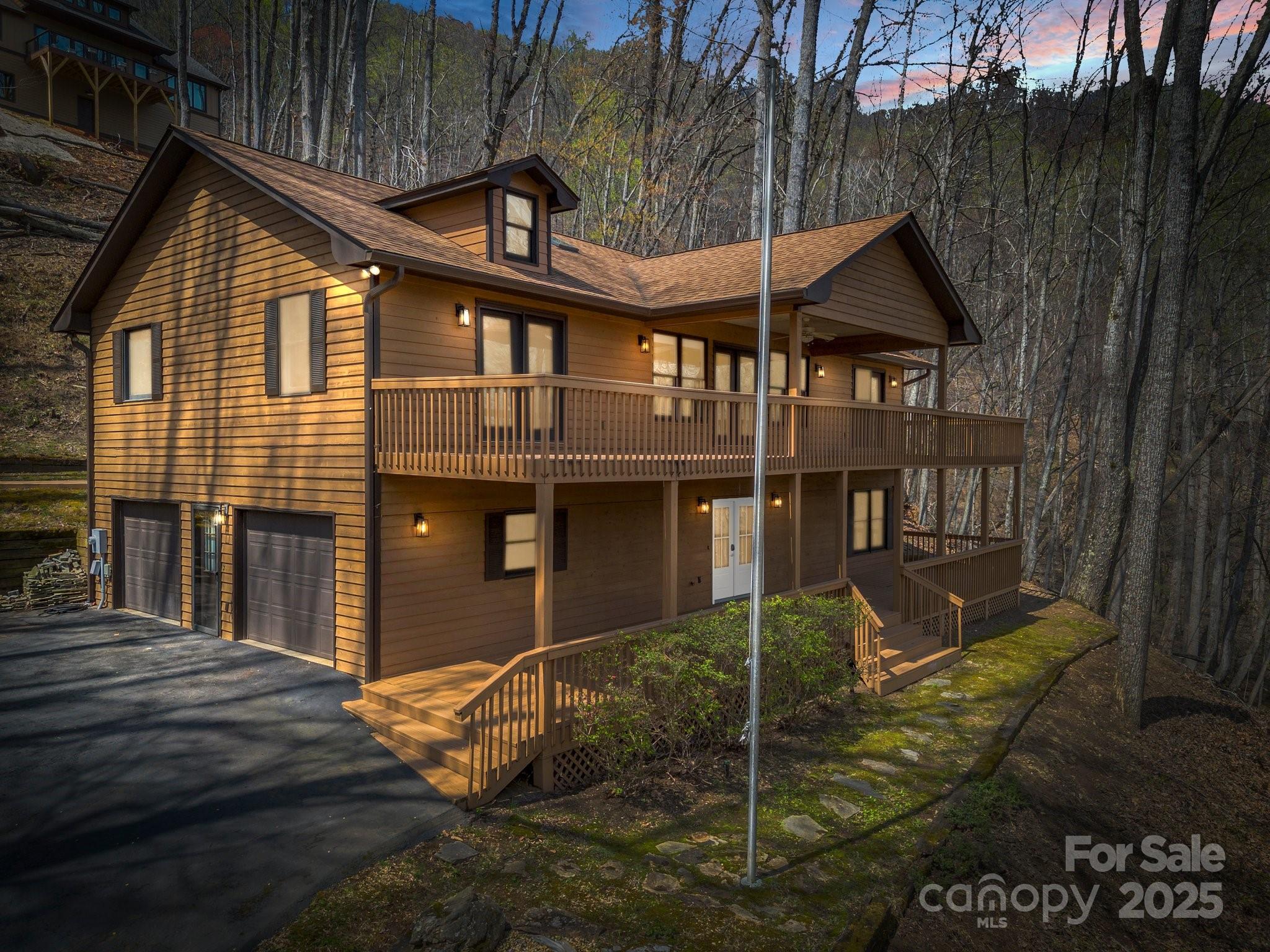 1116 High Vista Drive Mills River, NC 28759 - Photo 2 of 40 a front view of a house with garden