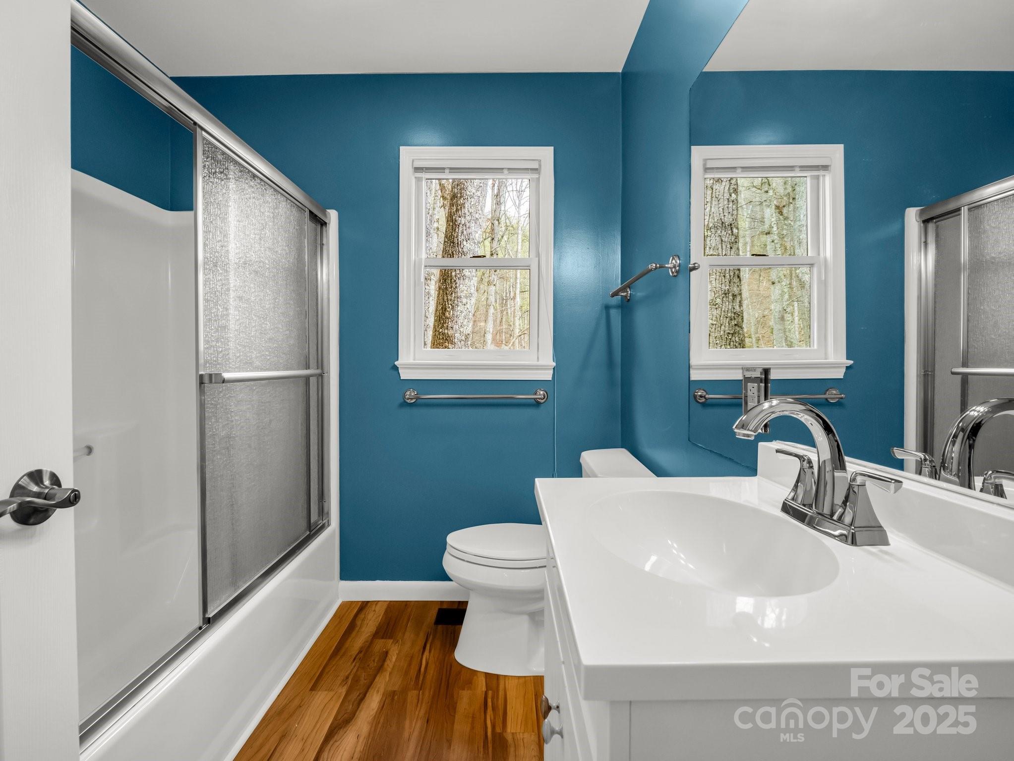 1116 High Vista Drive Mills River, NC 28759 - Photo 24 of 40 a bathroom with a sink a toilet and a large mirror