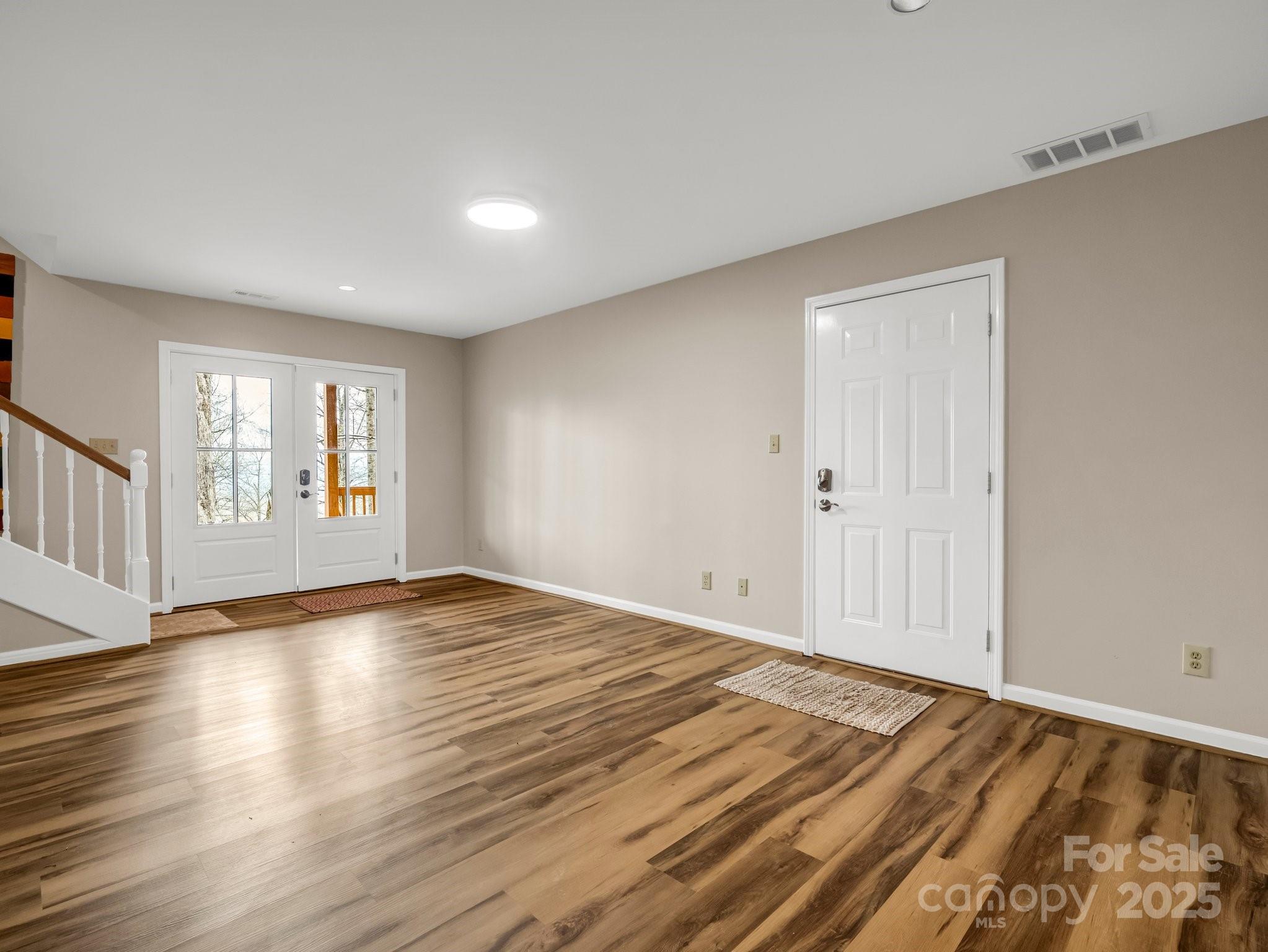 1116 High Vista Drive Mills River, NC 28759 - Photo 27 of 40 a view of an empty room with window and wooden floor