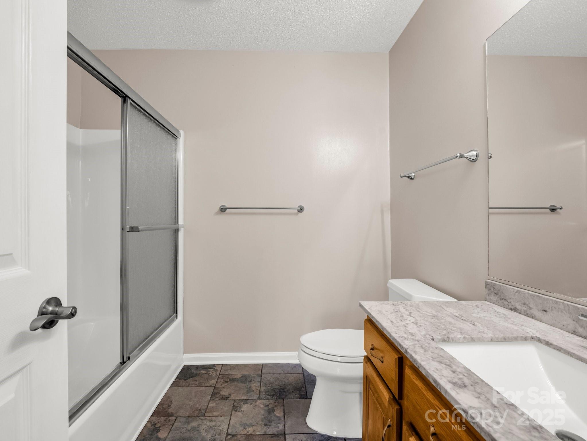 1116 High Vista Drive Mills River, NC 28759 - Photo 29 of 40 a bathroom with a granite countertop sink toilet and shower