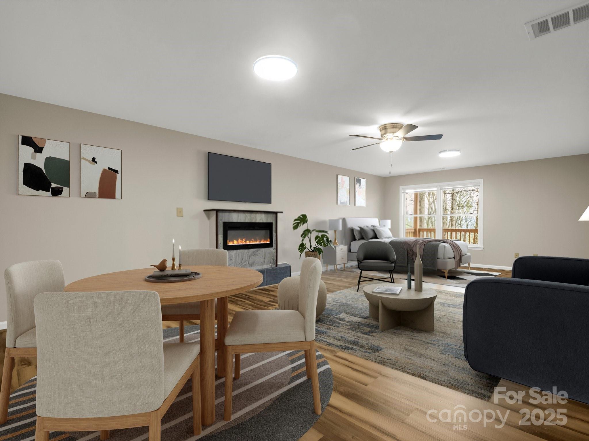 1116 High Vista Drive Mills River, NC 28759 - Photo 31 of 40 a living room with furniture a fireplace and a flat screen tv