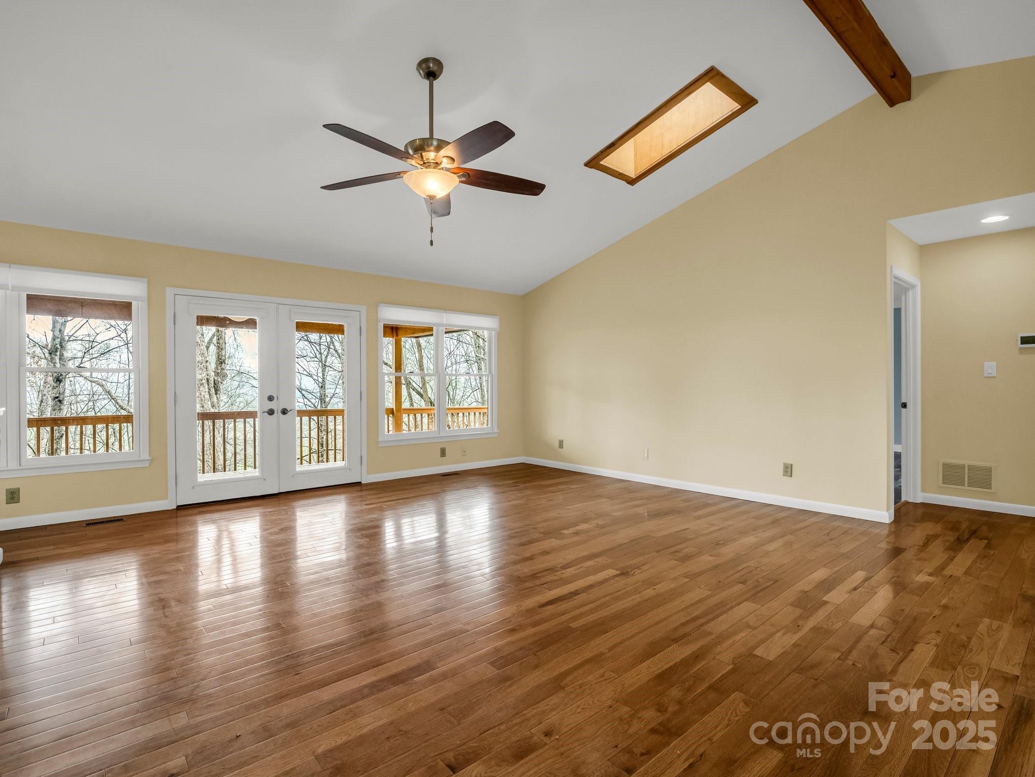 1116 High Vista Drive Mills River, NC 28759 - Photo 9 of 40 a view of an empty room with a window and wooden floor