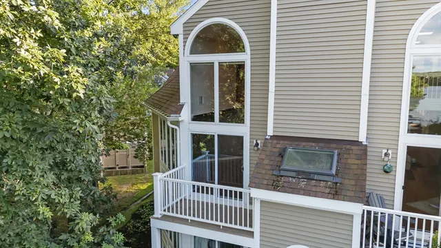 a view of a brick house with a large windows