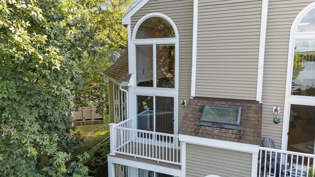 48 Pointe Rok Drive, Unit 48 Worcester, MA 01604 - Photo 24 of 42 a view of a brick house with a large windows