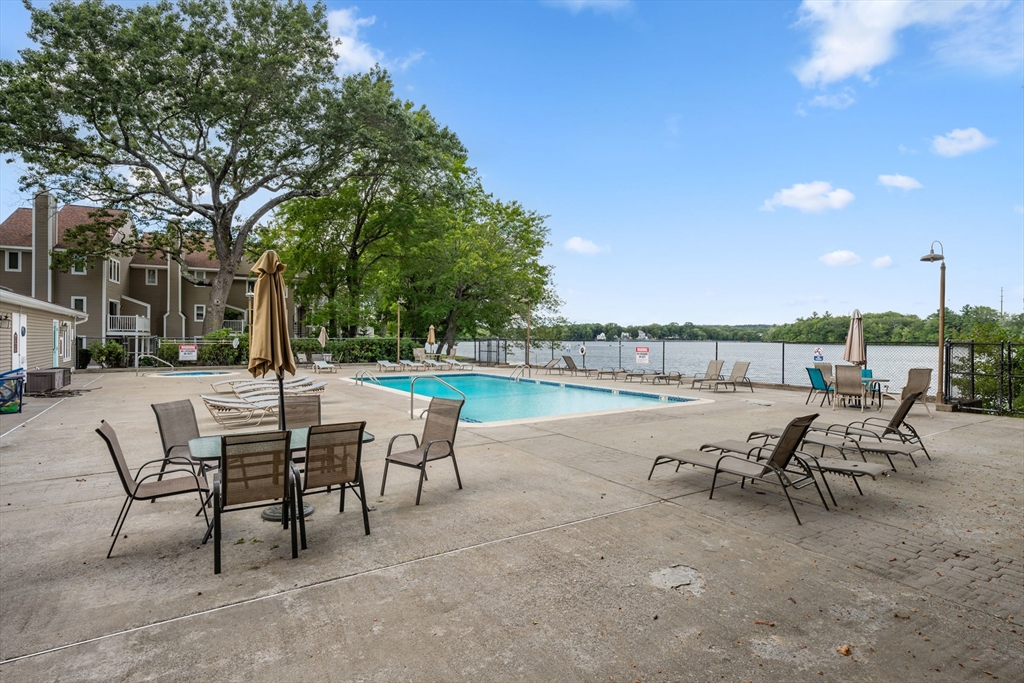 48 Pointe Rok Drive, Unit 48 Worcester, MA 01604 - Photo 29 of 42 a view of a terrace with furniture and a garden