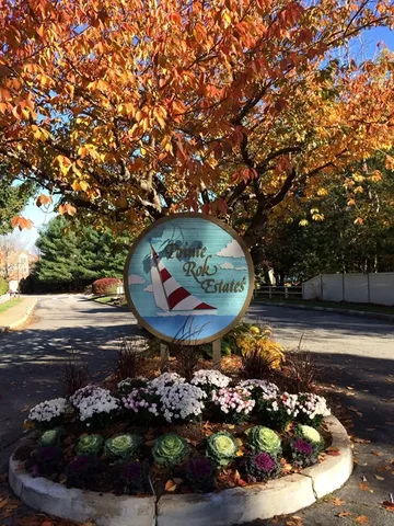 a view of a backyard with wooden fence