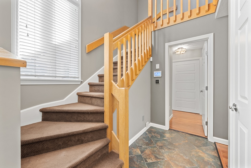 48 Pointe Rok Drive, Unit 48 Worcester, MA 01604 - Photo 4 of 42 a view of entryway bedroom and hall with wooden floor