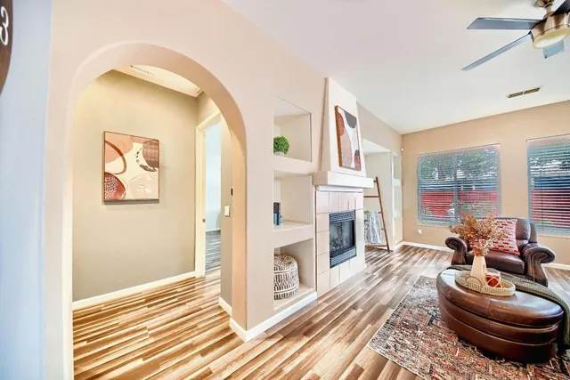 a living room with furniture and a fireplace