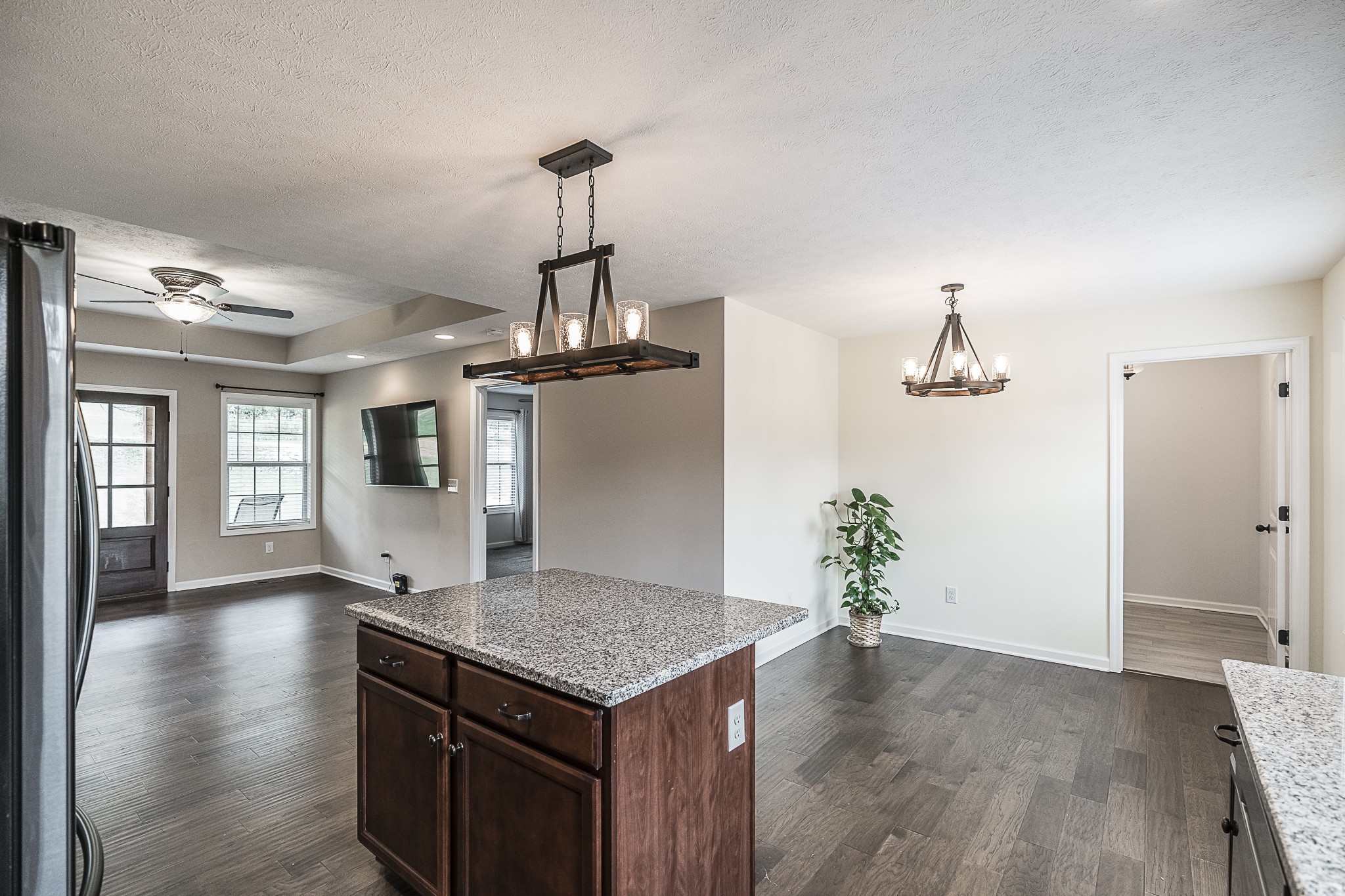 1829 Rock Bridge Road Bethpage, TN 37022 - Photo 14 of 32 a kitchen with kitchen island stainless steel appliances a sink window and wooden floor
