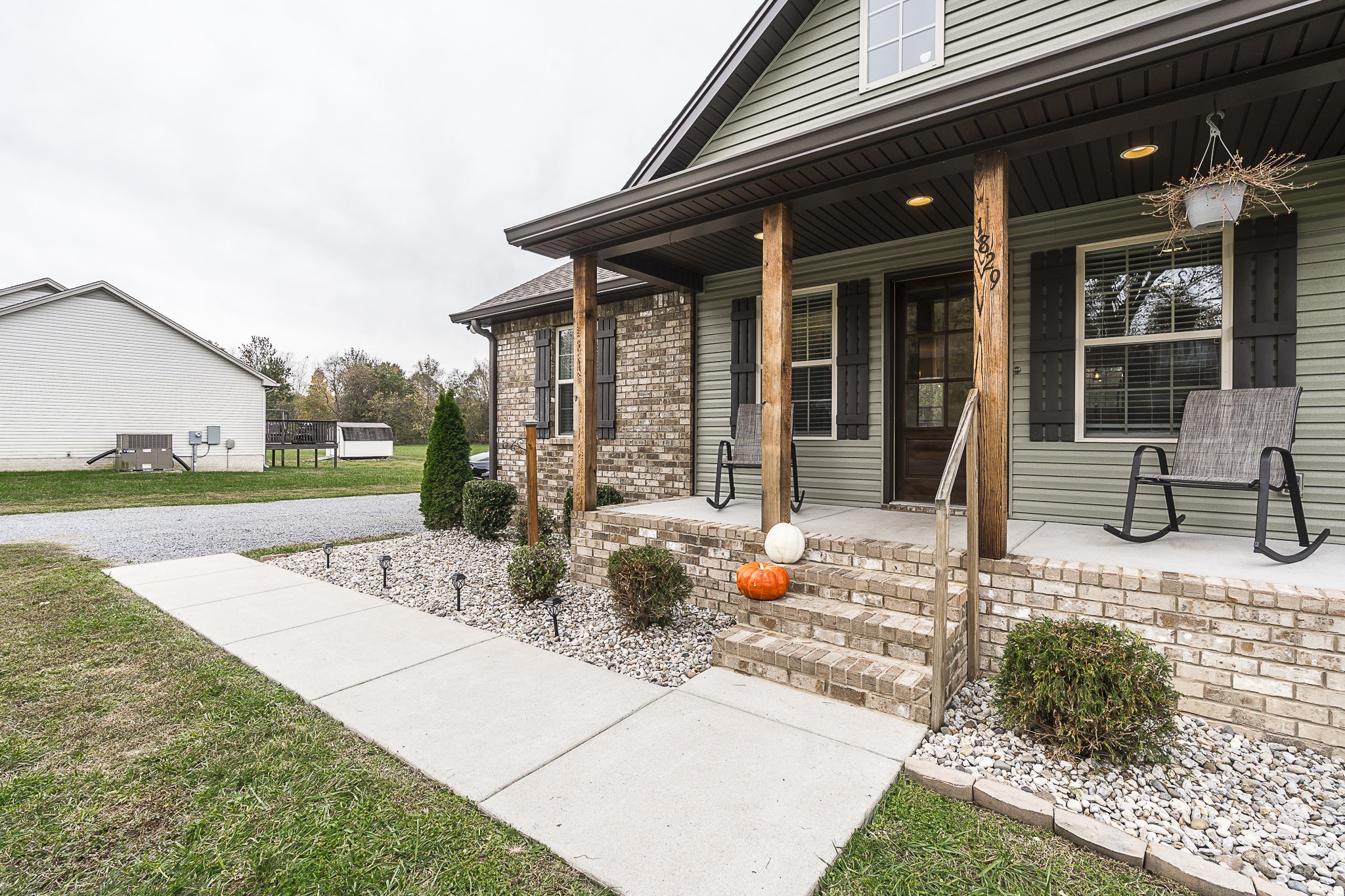 1829 Rock Bridge Road Bethpage, TN 37022 - Photo 3 of 32 a view of a house with backyard porch and sitting area