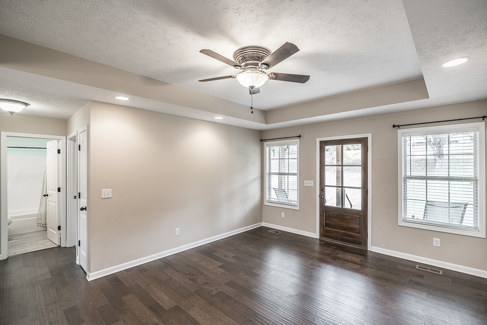 1829 Rock Bridge Road Bethpage, TN 37022 - Photo 8 of 32 a view of an empty room with a window and wooden floor