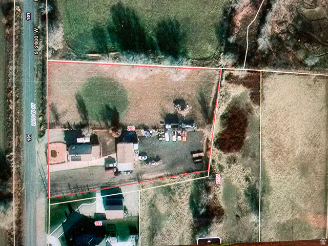 200 South 2800th Street West Ogden, UT 84404 - Photo 26 of 42 Aerial view of sparsely populated area with property boundaries highlighted