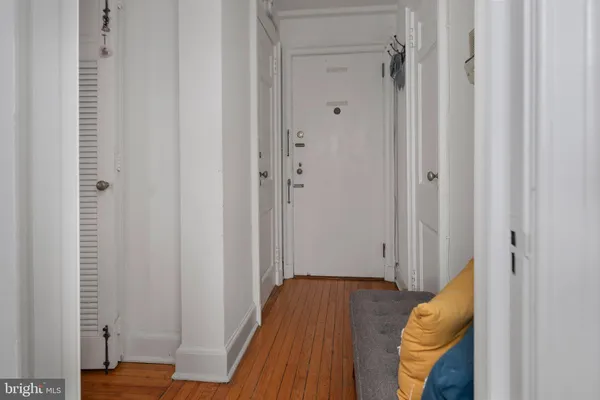 a view of bedroom with wooden floor