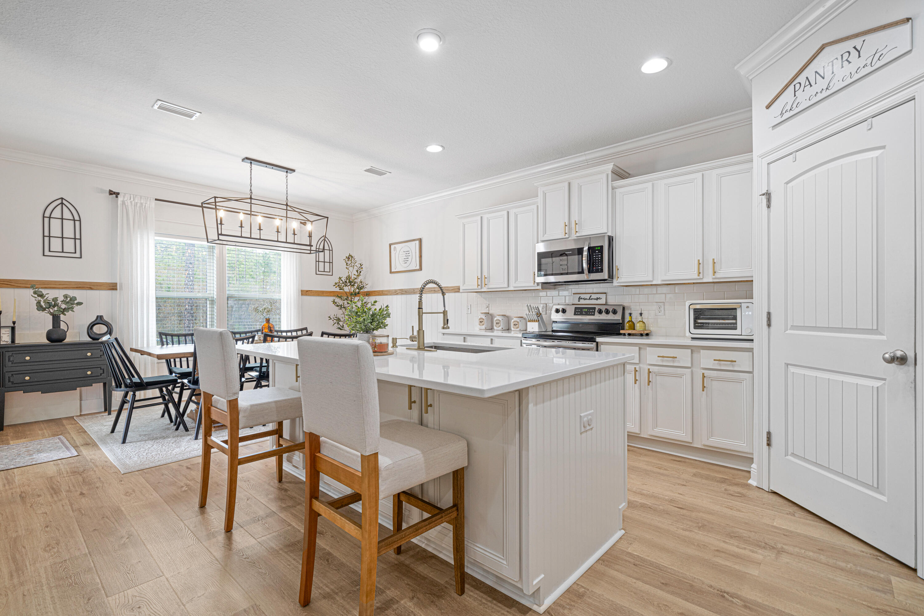 52 Conner Circle, Unit LOT 164 Santa Rosa Beach, FL 32459 - Photo 12 of 50 a kitchen with granite countertop white cabinets and stainless steel appliances