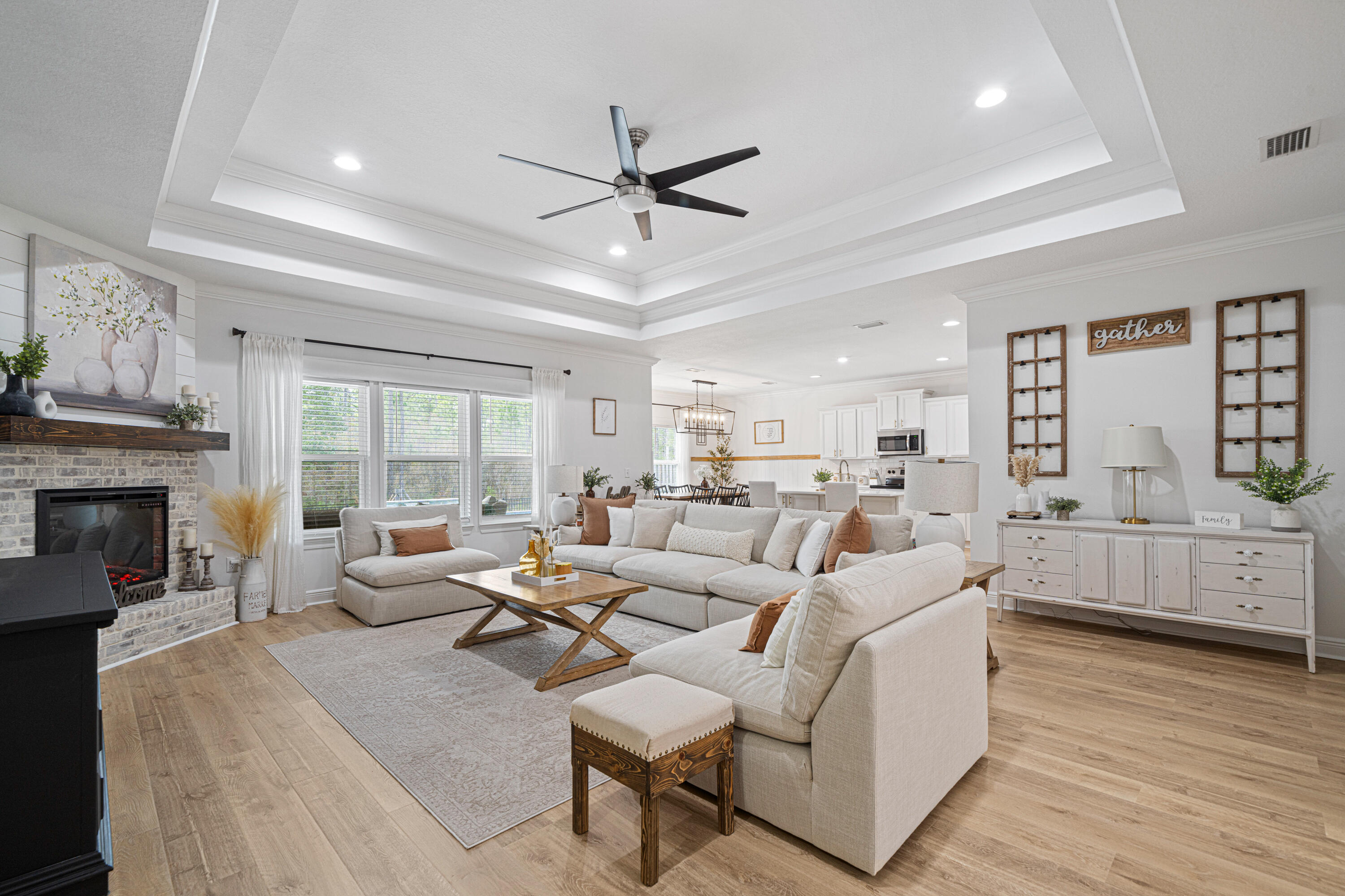52 Conner Circle, Unit LOT 164 Santa Rosa Beach, FL 32459 - Photo 14 of 50 a living room with fireplace furniture and a large window