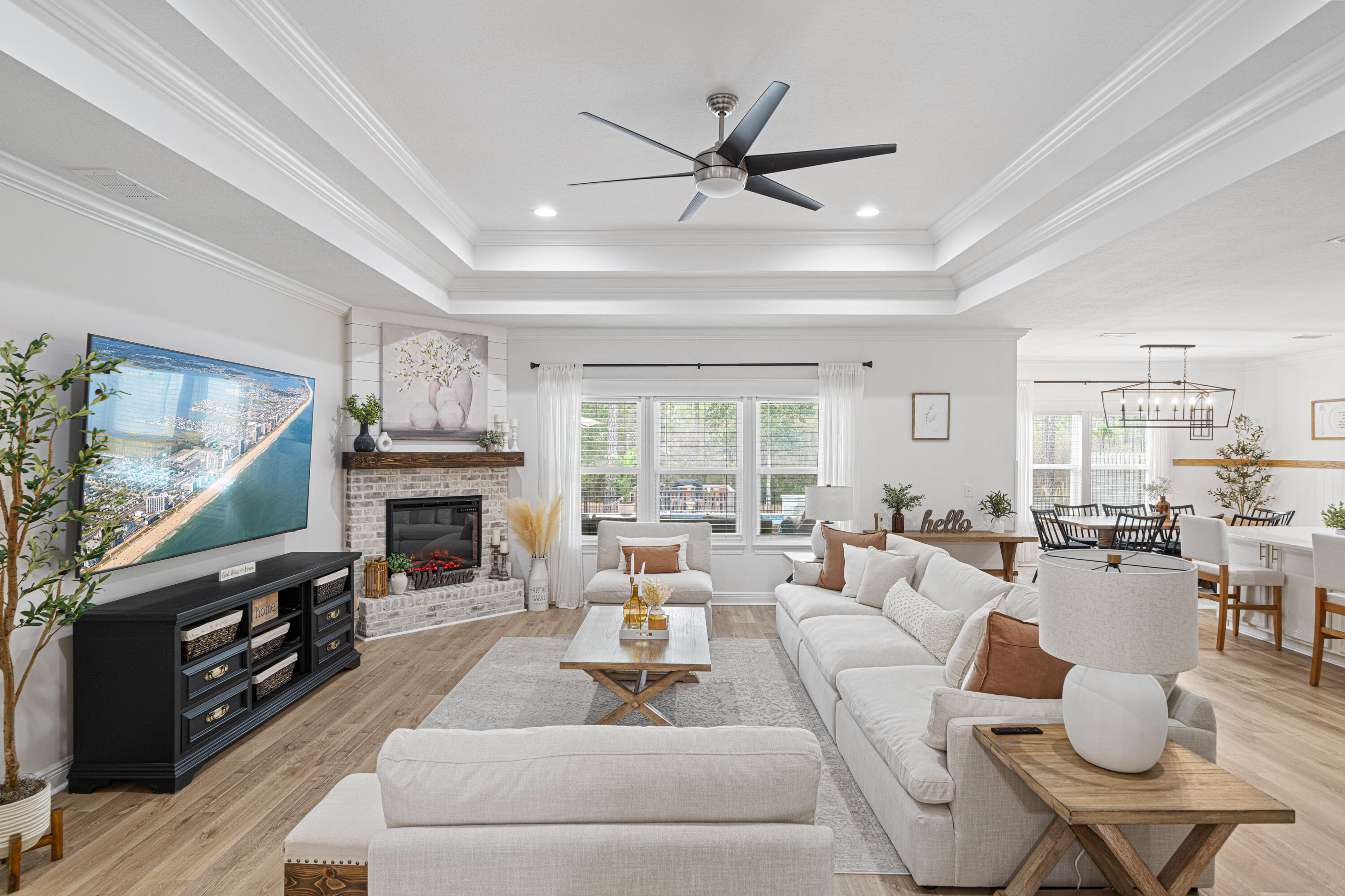 52 Conner Circle, Unit LOT 164 Santa Rosa Beach, FL 32459 - Photo 15 of 50 a living room with furniture a fireplace and a flat screen tv